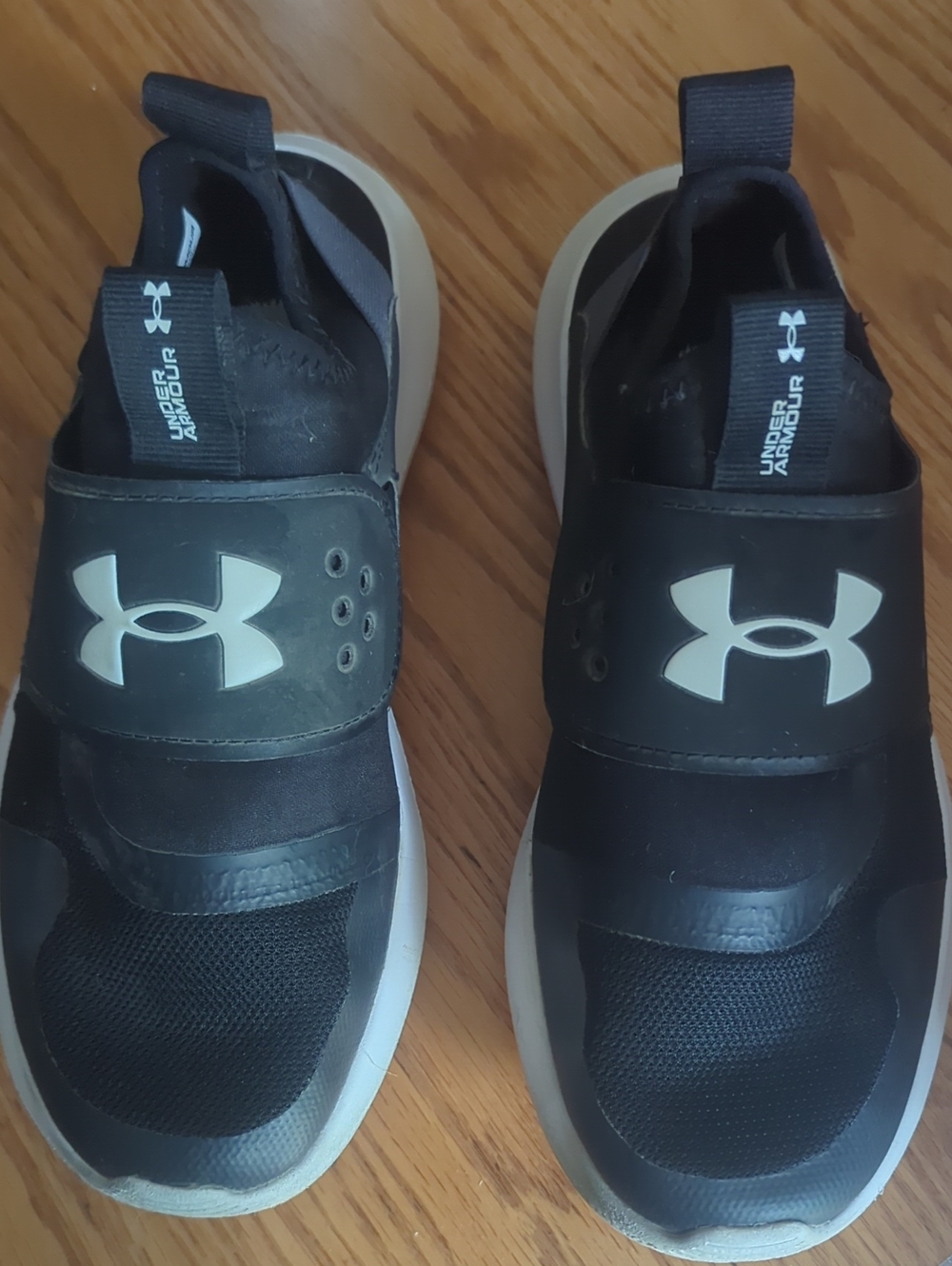 Under Armour Men’s/Kids Black and White Slip-On Athletic Sneakers